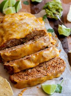 sliced meatloaf with cheese and avocado garnish on the side