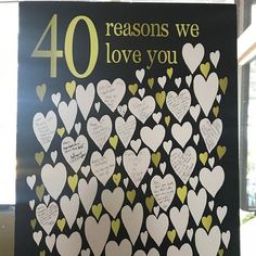 a sign that says 40 reasons we love you with lots of hearts on the front