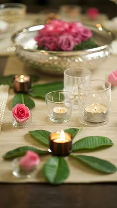 the table is set with candles and flowers