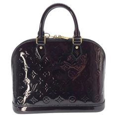 Elevate your style with the Louis Vuitton Monogram Vernis Alma PM bag. Handcrafted in France with burgundy colored patent leather and gold-tone hardware, it exudes sophistication and luxury. With a spacious interior and protective studs at the base, this bag combines practicality with elegance. Includes an Entrupy certificate of authenticity for peace of mind. Retail $2,350. Designer: Louis Vuitton Material: Monogram Vernis Patent Leather Color: Amarante Origin: France Date/Authenticity Code: FL Louis Vuitton Store, Alma Pm, Louis Vuitton Vintage, Sunglasses Logo, Lv Monogram, Chanel Vintage, Louis Vuitton Damier Ebene, Louis Vuitton Shoulder Bag, Vintage Louis Vuitton