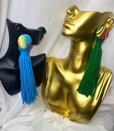 Add a pop of fun to your wardrobe with these handmade button and yarn tassel earrings! These lightweight, boho-chic earrings feature colorful yarn tassels hanging from vibrant buttons, creating a playful and unique accessory that's perfect for any occasion. Whether you're dressing up for a festival, or adding a quirky touch to your everyday look, these earrings will make a statement. Each pair is crafted with care, using high-quality materials to ensure comfort and durability. Express your individuality with these charming, one-of-a-kind earrings! Choose from our 7 variations.  Care Instructions: To keep your earrings looking their best, avoid contact with water and store them in a dry, safe place when not in use. Colorful Tassel Earrings For Summer, Bohemian Rainbow Tassel Earrings, Multicolor Tassel Earrings For Beach, Green Tassel Earrings For Beach, Handmade Green Tassel Earrings For Beach, Multicolor Fringe Tassel Earrings For The Beach, Multicolor Beaded Tassel Earrings For Beach, Multicolor Fringe Earrings For Beach, Handmade Multicolor Tassel Earrings For Beach