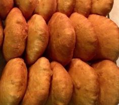 a pile of doughnuts sitting on top of a table