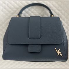 Brand New, Never Used Leather Handbag Made In Italy. Color Is Denim Blue. Very Pretty And Good Quality. Https://Vabyalevillegas.Com Condition Nwot Size: Approximately 10 Inches Wide X 7 Inches Height Versatile Blue Top Handle Satchel, Blue Casual Bag With Branded Hardware, Casual Blue Bag With Branded Hardware, Casual Blue Bags With Branded Hardware, Versatile Blue Top Handle Bag, Blue Top Handle Satchel For Work, Casual Blue Bags For Workwear, Casual Blue Bags For Work, Designer Leather Handbags