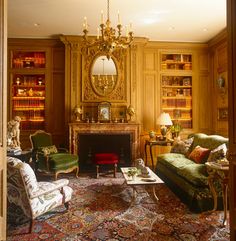 a living room filled with furniture and a fire place in the middle of a room