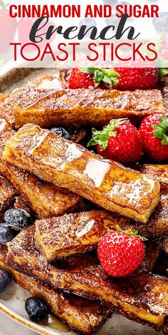 cinnamon and sugar french toast sticks on a plate with strawberries