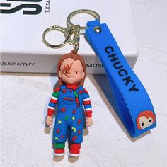 a keychain with a cartoon character on it and a name tag attached to it