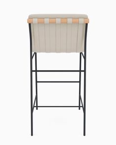 a white and black stool with a wooden seat on it's backrest, in front of a white background