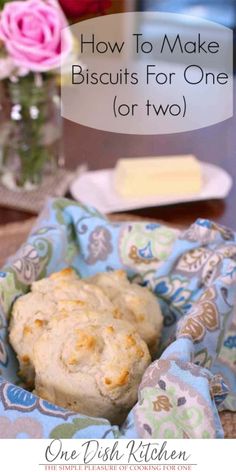 a close up of a muffin on a cloth with flowers in the background and text overlay reading how to make biscuits for one or two