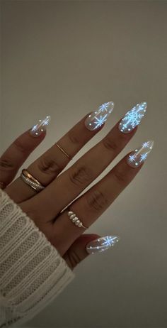 Basic Winter Acrylic Nails, Easy Nail Snowflake Design, Nails For New Years And Christmas, Winter Nails Ideas 2024, Christmas Nails Glow In The Dark, Light Blue Glitter Ombre Nails, Snowflake Nail Art Designs, Christmas/new Years Nail Designs, Simple Aesthetic Christmas Nails