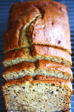 a loaf of banana bread sitting on top of a cooling rack