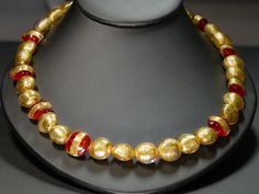 Gold and Red 24K Gold Leaf Murano Glass Necklace Formal Gold Beaded Necklaces, Yellow Gold High Luster Round Beads Necklace, Yellow Gold Necklace With High Luster Round Beads, Luxury Gold Beaded Necklace With Polished Beads, Formal Gold Necklace With Polished Beads, Gold Necklace With Polished Beads For Formal Occasions, Formal Gold Glass Jewelry, Gold Glass Necklaces For Formal Occasions, Gold Beaded Necklace With Large Beads For Celebration