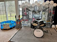 a room filled with musical instruments and balloons