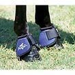 the legs and feet of a horse with boots on it's ankles, standing in grass