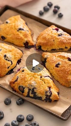 blueberry scones on a baking sheet with a knife