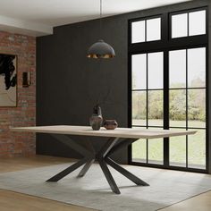 a modern dining table in front of a large window