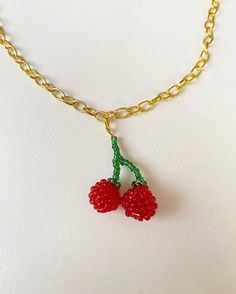 This pendant is completely hand beaded using dark red and glittery green seed beads to create a mini cherry charm. Make a real statement with this unique necklace! These beads really catch the light and stand out and are attached to a gold plated link chain complete with a lobster clasp for easy attachment. All of my pieces are completely hand sewn from scratch and made with love! Please message if you are interested in a custom set, or message me on instagram @queefs.and.kisses for more information on custom prices and options. Postage in the UK is included in all prices. Seed Bead Cherry Necklace, Bead Cherry, Gold Lingerie, Cherry Charm, Cherry Necklace, Unique Necklace, Gold Plated Chains, Unique Necklaces, Hand Beading