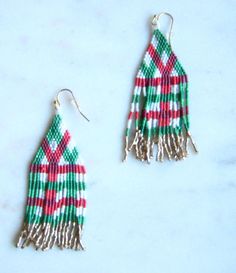 Red, green, white and gold plaid seed beaded earrings - Gold-tone ear wires Drop length 3 inches Holiday earrings Statement earrings I fully guarantee all of my items. If you have any problems, contact me and I will take care of your concerns. Please contact me with any questions. I am always glad to help. Plaid Earrings, Seed Beaded Earrings, Beads Christmas, Holiday Earrings, Earrings Christmas