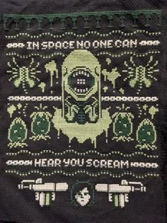 a cross - stitch pattern on a black cloth with green and white designs that reads, then peace no one can hear you scream