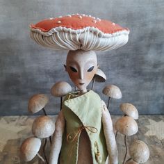 a stuffed animal with mushrooms on its head