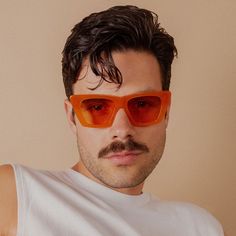 Enjoy the clarity of polarized lenses and the affordable luxury quality. From urban escapades to your next road trip, you won't want to leave home without them. The Uptown square sunglasses in orange are styled in a sleek apricot frame with soft amber lenses for a timeless, everyday look. Handcrafted bioacetate frames made from plant-based materials. Earth-friendly and Rx-ready, complete with polarized lenses for 100% UVA/UVB protection. Reinforced with optical-grade stainless steel hardware and Apricot Color, Earth Friendly, Affordable Luxury, Polarized Lenses, Polarized Sunglasses, Everyday Look, Square Sunglasses, Apricot, Plant Based