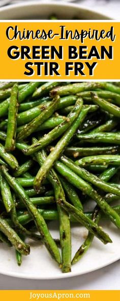 green bean stir fry on a white plate with text overlay that reads chinese - inspired green bean stir fry