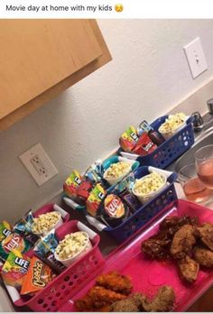 a pink tray filled with food on top of a kitchen counter