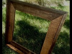 a wooden frame sitting in the grass