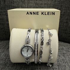 Mother-Of-Pearl Dial With Silver-Tone Hands And Markers; Silver-Tone “X” Shaped Bracelet Accented With 12 Clear Crystals, Adjustable End Links, Jewellery Clasp And Extender Japanese-Quartz Movement Set Includes Three Crystal Accented Bracelets; One Bangle, One Chain Bracelet With Dangling Charms And One “X” Shaped Bracelet Battery Needs To Be Replaced Anne Klein Watch Silver, Anne Klein Watch, Watch Set, Jewelry Clasps, Clear Crystals, Dangle Charms, Steel Watch, Stainless Steel Watch, Anne Klein