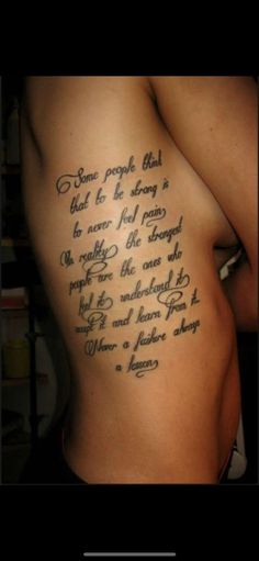 the back of a man's stomach with an inscription on it that reads,