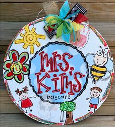 a paper plate with the words mrs king's daycare on it and some cartoon characters