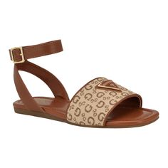 PRICES MAY VARY. Adorned with a metal GUESS logo plate, this ankle strap sandal is your go to sandal of the season. Fashion forward colors and materials and a little flat heel allows for style and comfort. Est. 1981, Guess is a global lifestyle brand and a symbol of a young, adventurous lifestyle. Open/Square Toe ; Buckle Closure Textile/Faux Leather Upper 0.35" heel height Adventurous Lifestyle, Guess Logo, Fashion Sandals, Black Logo, Lifestyle Brand, Ankle Strap Sandals, Lifestyle Brands, Flat Sandals, Black Sandals