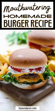 two cheeseburger burgers on a cutting board with french fries