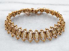 This beautiful yellow 18-karat gold Victorian bracelet is adorned with ornate links for an eye-catching look. Crafted from solid gold, it's perfect for adding a touch of luxury to any outfit. Metal: 18K Yellow Gold Width: 14.9 mm Inside Circumference: 7 Inches Marks: "18" Stamped on the clasp To view a video of this piece check out the link below:  https://vimeo.com/911342170 SKU #: A35914 Each piece has been identified and graded by a Graduate Gemologist who has been certified by the Gemologica Victorian Bracelet, Gold Link Bracelet, Pocket Watch Chain, Box Clasp, Watch Chain, Pearl Pendant, Chain Link Bracelet, New Hampshire, Charm Earrings