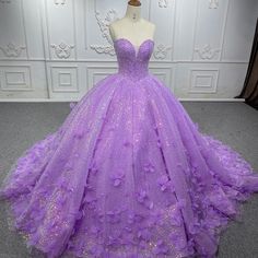 Make a dazzling entrance in this Quinceanera Dress that combines sparkling glamour with timeless elegance. This A-line gown is crafted from luxurious purple sequin fabric and features a sweetheart neckline that flatters the bust and creates a graceful, feminine silhouette. The intricate applique detailing and shimmering sequins embellish the bodice, adding a touch of sparkle and sophistication that will catch the light from every angle. The sweep train adds a romantic flow to the design, creatin Champagne Quinceanera Dresses, Sequin Ball Gown, White Quinceanera Dresses, Purple Quinceanera Dresses, Black Quinceanera Dresses, Quinceanera Dresses Gold, Fancy Stuff, Gala Gown, Purple Wedding Dress