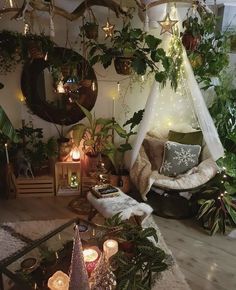 a living room filled with lots of plants and candles