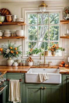 a kitchen with green cabinets and wooden counters