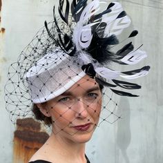 This Handmade One Of A Kind Fascinator Is Fun And Elegant And Is Sure To Delight. Designed With High Quality Sinamay, French Made Grosgrain Ribbon, Vailing And Premium Feathers. Comes With A Hat Box. This Fascinator Will Make A Wonderful Addition To Your Kentucky Derby, Or Ascot Ensemble Elegant White Mini Hats For Events, White Pinched Crown Hat For Party, White Pinched Crown Hat For Parties, White Party Hat With Pinched Crown, White Fitted Hat With Pinched Crown, Elegant White Costume Hat For Royal Ascot, Elegant White Top Hat With Structured Crown, Chic White Fitted Costume Hats And Headpieces, Elegant White Top Hat For Evening