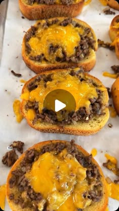 cheeseburger burgers with melted cheese on top are ready to go into the oven