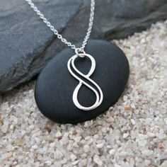 "This simple, lightweight necklace features a small infinity charm on a delicate sterling silver chain. This necklace will go with everything and is perfect for everyday wear. The popular infinity symbol symbolizes eternity, empowerment, and everlasting love. Give as a gift to show someone how much you care about them. Silver has unique calming, cooling and soothing properties, and helps to improve intuition, love and emotional well-being. It's a color of strength, clarity, and focus.  Silver is Everyday Nickel-free Infinity Jewelry, Personalized Minimalist Infinity Necklace, Silver Infinity Jewelry For Best Friend Gift, Silver Infinity Jewelry For Best Friend, Minimalist Sterling Silver Infinity Necklace, Hypoallergenic Infinity Jewelry For Everyday, Minimalist Nickel-free Infinity Jewelry, Silver Infinity Necklace, Infinity Necklace Silver