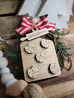 a wooden snowman ornament with buttons on it