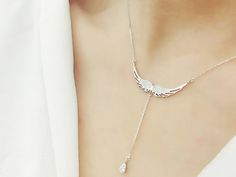 ✨ Embrace a touch of elegance with our Fashionable 925 Sterling Silver Wings Necklace, a hot trend in sterling-silver-jewelry. This stunning piece features angelic Zircon wings, creating a unique and stylish accessory. ⚜️ Crafted with precision and stamped with 925, the necklace showcases silver-colored angel wings, making it a perfect choice for weddings, special occasions, or adding a fashionable flair to your everyday style. 💖 The exquisite design and high-quality materials make it an ideal gift for women who appreciate timeless and fashionable jewelry. Elevate your look with this sterling silver necklace that effortlessly combines sophistication and charm. Elegant Angel Wings Necklaces, Elegant Wing-shaped White Gold Necklace, Elegant White Gold Wing-shaped Necklace, Elegant Sterling Silver Winged Necklace, Elegant Jewelry Pendant With Angel Wings, Elegant Silver Necklace With Angel Wings, Elegant Silver Jewelry With Angel Wings, Elegant Silver Wing-shaped Jewelry, Elegant Silver Angel Wings Jewelry