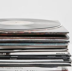 a stack of records sitting on top of each other