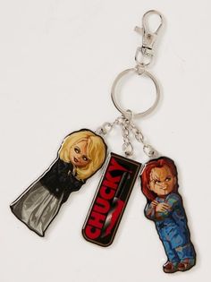 two keychains with the characters from back to the future on them, one is holding