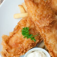 fried fish and fries on a white plate