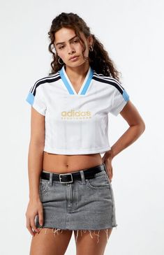 Elevate your casual style with the Tiro Cut 3-Stripes Cropped Jersey from adidas. Crafted from recycled materials, this sporty crop top brings a football-inspired flair to your everyday look. The soft doubleknit fabric and V-neck ribbed collar offer comfort and a nod to classic sport aesthetics. With its cropped cut and wide stripes, this jersey seamlessly transitions from daytime outings to evening events, effortlessly pairing with tights or jeans.Contrast 3-StripesShort sleevesV-necklineadidas graphicCropped length100% recycled polyesterMachine washableModel is wearing a size smallModel measurements: 5’5” height, 31” bust, 23” waist, 36” hipsLearn more about PacSun eco items adidas Womens Tiro Cut 3-Stripes Cropped Jersey - White size Small Summer Sports Tops With Three Stripes Branding, Adidas White Activewear With Three Stripes, White Spring Activewear With Three Stripes Branding, Summer Sports Tops With Three Stripes, White Activewear For Spring, Sporty Streetwear Tops With Contrast Stripes, Sporty Crop Top For Spring Streetwear, White Athleisure Crop Top For Streetwear, Sporty White Crop Top