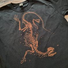 a t - shirt with an image of a skeleton running