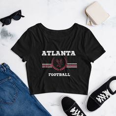 Elevate your game day wardrobe with our NFL Atlanta Falcons inspired crop top, the ultimate fashion statement for die-hard Falcons football fans. Crafted with passion and precision, this crop top is designed to showcase your team spirit while keeping you comfortably chic. Our NFL-inspired crop top is made from breathable materials to ensure all-day comfort, whether you're tailgating or watching the game from the couch. ✂️ Stylish Crop Cut: The trendy cropped design adds a touch of fashion-forwar Falcons Football, Baby Crop Top, Baby T Shirts, Atlanta Falcons, Florida State, Die Hard, Nfl Teams, Football Fans, Crop Tee