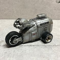 a toy motorcycle made out of metal parts