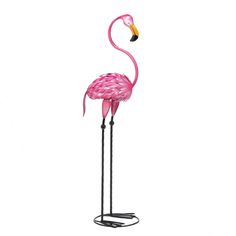 a pink flamingo standing on top of a metal stand