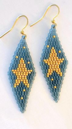 two pairs of beaded earrings with gold stars on blue and yellow seed stitching